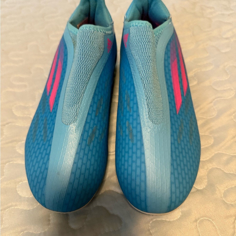 adidas Kids Soccer slip on cleats.  Blue and Pink. Barely worn Size 4Y